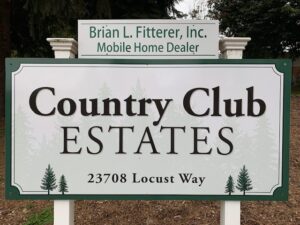 Country club estates sign promoting the quick sale of these new homes.